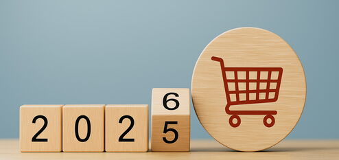 Holzklötze mit 2026 und Einkaufswagen-Symbol zu E-Commerce Änderungen 2026 und neuen Regeln für Onlinehändler